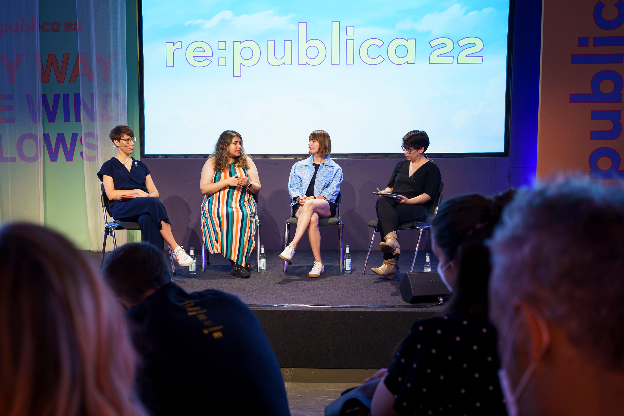 The photo shows the four panelists, Ellen Ehmke, Hera Hussain, Michelle Thorne and Julia Kloiber sitting on stage with a large sign behind them depicting the logo of republica.